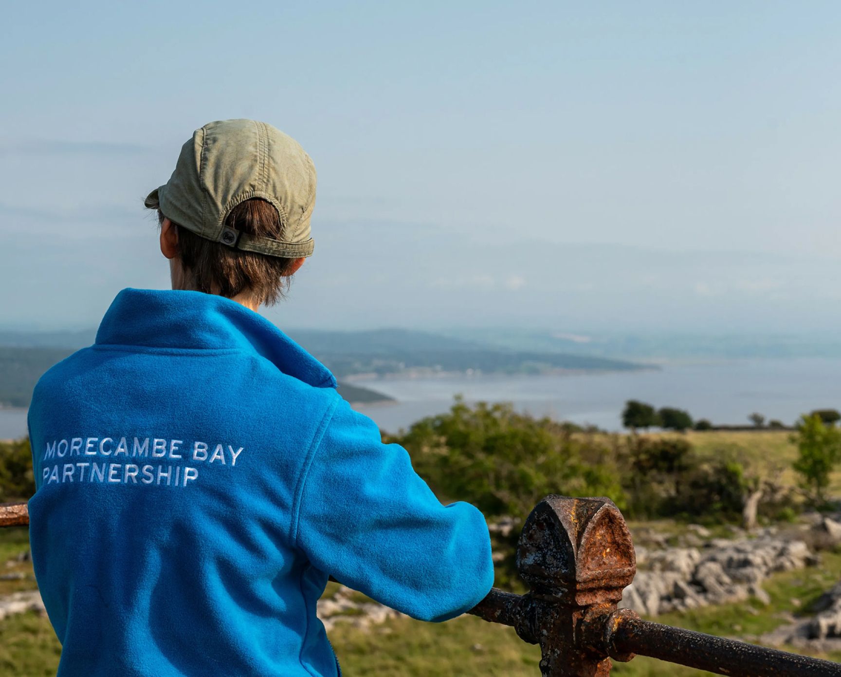A man wearing Morecambe Bay Partnership branded apparel